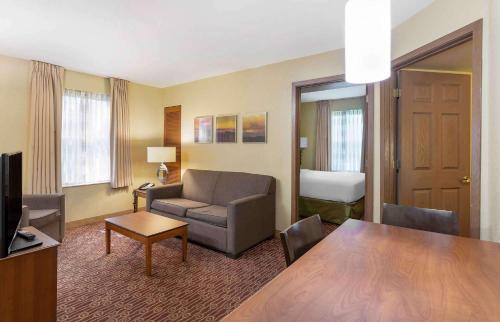 a living room with a couch and a table at Extended Stay America Suites - Chantilly - Dulles in Chantilly