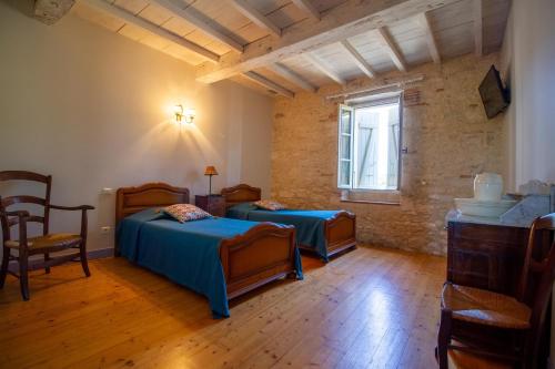 Postel nebo postele na pokoji v ubytování Gîte d'En Lébé