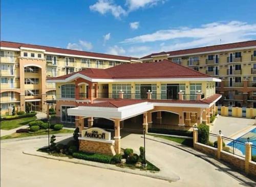 a building in front of a large building at Homestay Arezzo Place Davao - Building 9 in Davao City