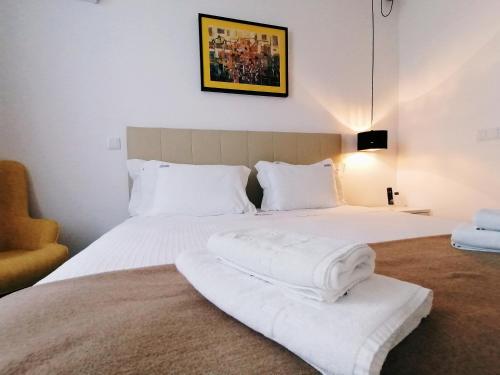 Cama ou camas em um quarto em Coimbra Monumentais B&B