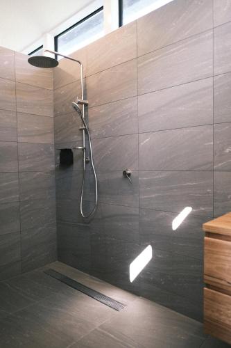 a bathroom with a shower with a shower head at Buller Wines in Rutherglen