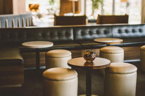 a row of tables and stools in a restaurant at Delta Hotels by Marriott Waterloo in Waterloo