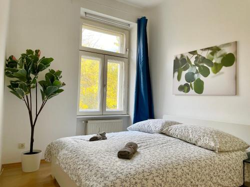 a bedroom with a bed with shoes on it at 100 m2 Apartment - Free Parking- 15 min to Center in Vienna