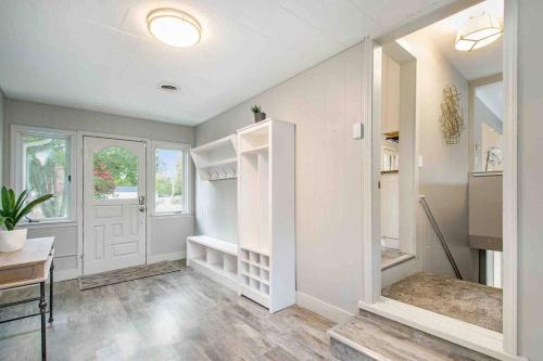 a room with a white door and a table and a desk at Arrowhead Riverfront Kayaks/Patio 30 Min to ND! in Bristol