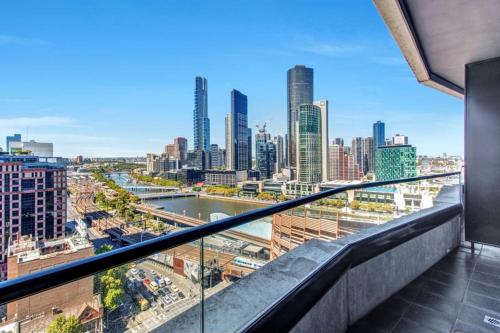 a view of a city skyline from a balcony at Riverview Suites by EdgeTrip in Melbourne