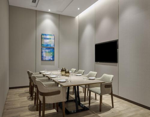 a conference room with a long table and chairs at Hyatt Place Johor Bahru Paradigm Mall in Johor Bahru