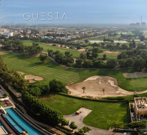an aerial view of the golf course at a resort at Fairways Tower by Emaar, The Views and Greens in Dubai