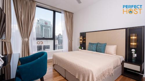 a bedroom with a bed and a large window at Pavilion Ceylon Hill Suites, Bukit Bintang in Kuala Lumpur