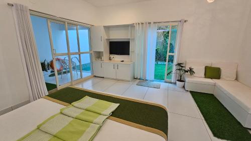 Amritham Holidays Homestay Trivandrumにあるベッド