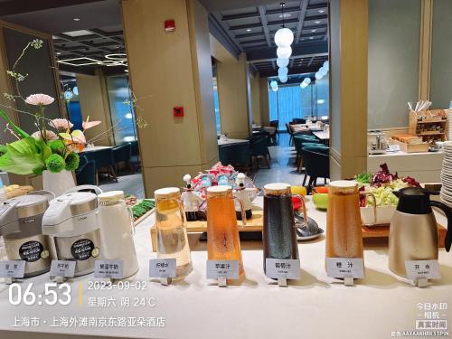 a table with condiments on it in a hotel room at Shanghai Atour Hotel On The Bund- People Square in Shanghai