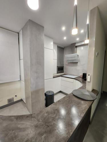 a kitchen with a counter top in a room at SARDINERO in Santander