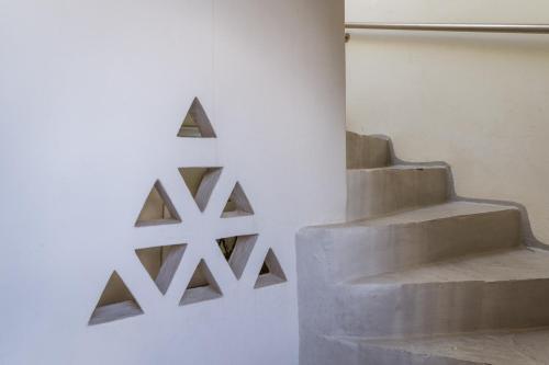 a set of stairs in a room with a wall at En Tino 2 in Tinos Town