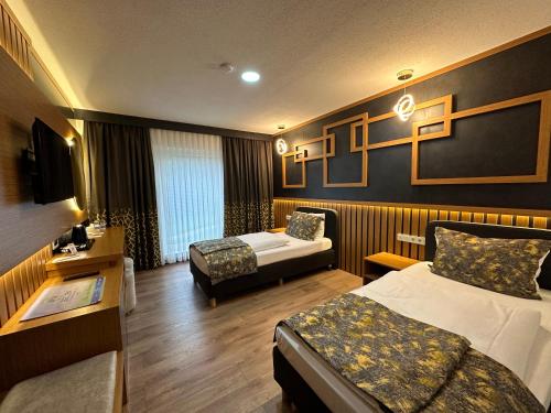 Un pat sau paturi într-o cameră la Hotel Belen Fahrenkrug