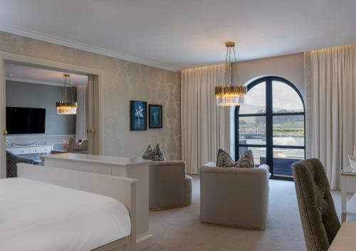 a large living room with a bed and a couch at The Hazendal Hotel and Homestead in Stellenbosch