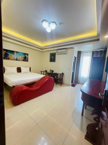 Postel nebo postele na pokoji v ubytování Đà Lạt Hotel