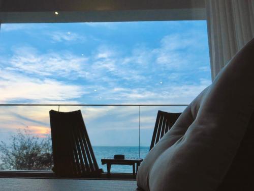 a living room with a view of the ocean at Kenting Onehome in Checheng