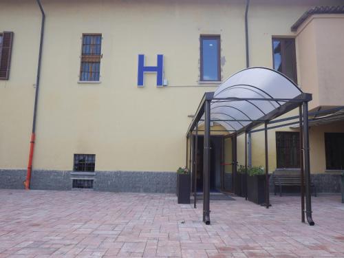 a building with a shelter in front of it at La Boheme SMART Hotel in Turin