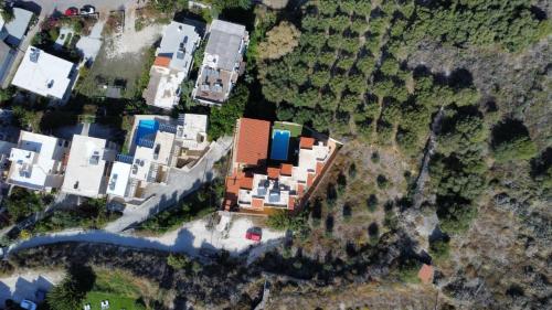 an aerial view of a house and a river at Villa Georgia in Kalyves