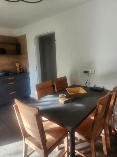 a dining room with a table and chairs at Apartment am Südhang 2 in Dinkelsbühl