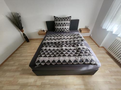 a large bed in a room with at Apartment am Südhang 2 in Dinkelsbühl