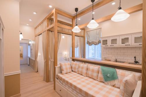 a living room with a couch and a window at Revelton Suites Tallinn in Tallinn