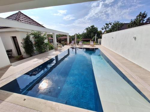 a swimming pool in the backyard of a house at TREND in Arad