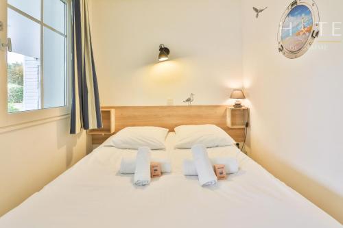 Postel nebo postele na pokoji v ubytování Superbe appartement en résidence avec piscine