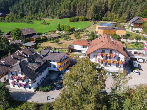 an aerial view of a village with houses at Hotel Elisabeth in Chienes