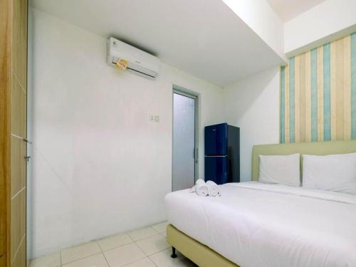 OYO LIFE ROOMS BY MIXO tesisinde bir odada yatak veya yataklar