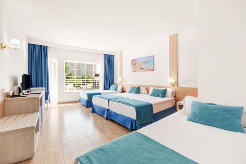 Ένα ή περισσότερα κρεβάτια σε δωμάτιο στο Hotel Agua Beach "Adults only"