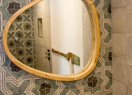 a mirror in a bathroom with a shower at Bed & Breakfast Los-Barquitos in Torrox