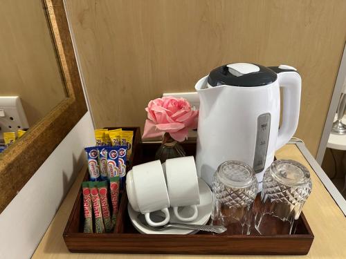 a wooden tray with a coffee maker on a counter at Repa Boutique Guest Lodge in Kimberley