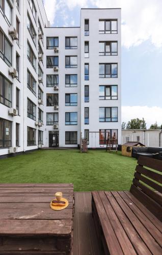 a large building with a large yard in front of it at Nyvky Like Home - Studio - apt 40 apt 46 in Kyiv