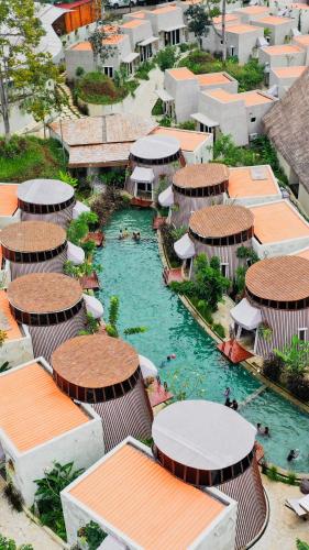 an aerial view of a water park with buildings at Dusun The Villas in Bawen