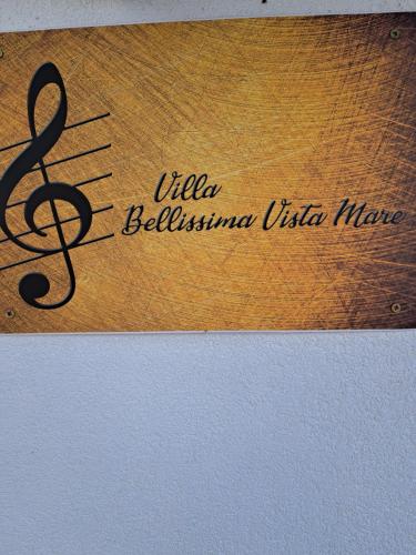 a sign that reads ulla belliniiniiniiniiniiniiniini at Villa Belissima Vista Mare in Selce