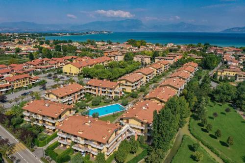 an aerial view of a city with houses and the ocean at Dolce Vita Family Apartment in Sirmione