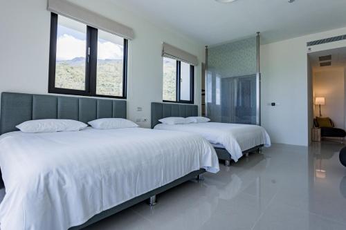 Cama o camas de una habitación en 漫步月眉民宿