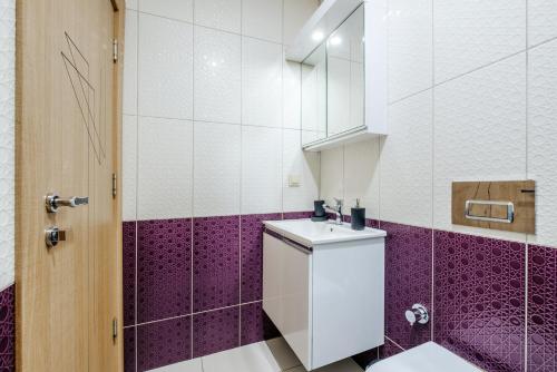 a bathroom with a toilet and a sink at Chic Flat w Garden Nature View in Kemer in Antalya