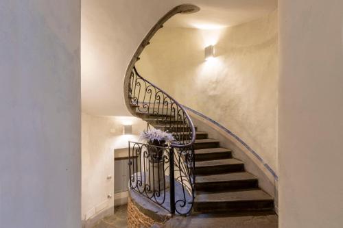 a spiral staircase in a house at numa I Felice Rooms & Apartments in Florence