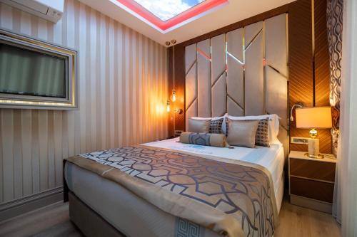 Ένα ή περισσότερα κρεβάτια σε δωμάτιο στο Elysium Deluxe Suites Antalya