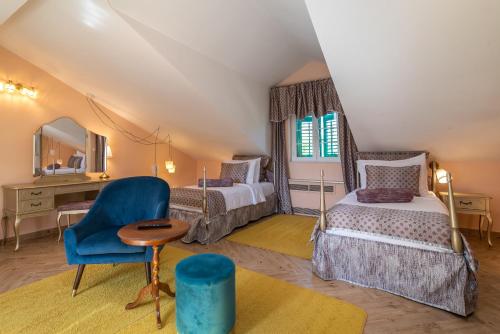 Postel nebo postele na pokoji v ubytování Heritage Hotel Pasike