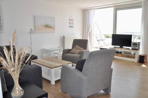 TV a/nebo společenská místnost v ubytování Duinerei Penthouse B302