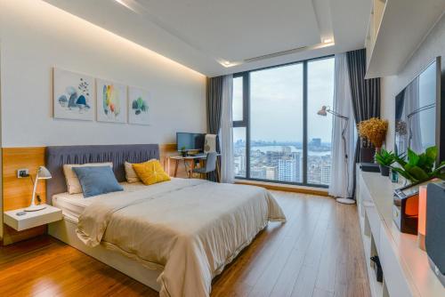 Кровать или кровати в номере 22housing Vinhomes Metropolis Hotel & Apartment