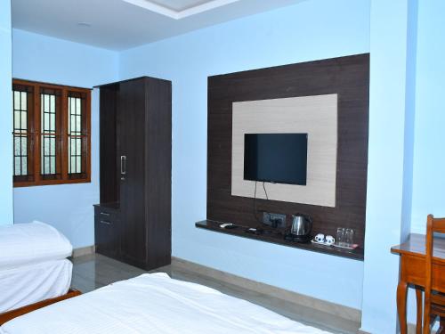 Tempat tidur dalam kamar di SG ARK RESIDENCY