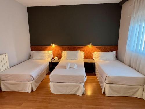 Postel nebo postele na pokoji v ubytování AP Hotel Madrid Airport