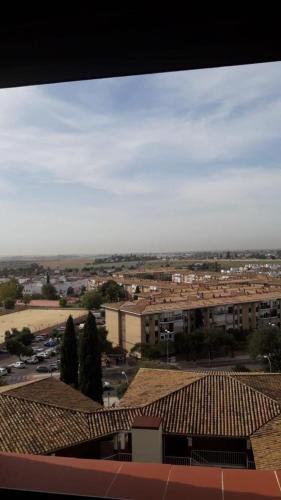 a view of a city from the roof of a building at Habitaciones bonitas in Mairena del Aljarafe