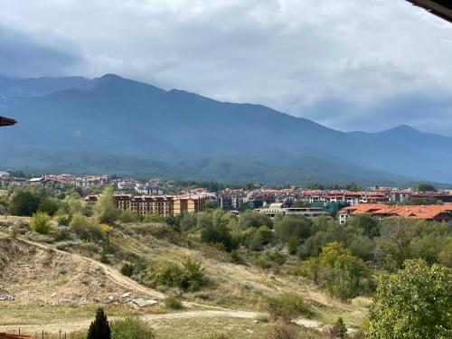a view of a city with a mountain in the background at Bansko St Ivan Rilski Luxury Apartment 4 stars Free SPA & Mineral water in Bansko