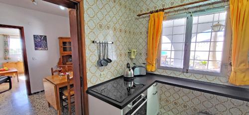 a kitchen with a sink and a window at Casa Perrito Gris in Playa Jandia
