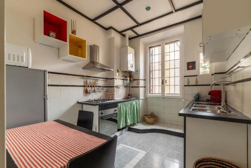 a kitchen with a sink and a counter top at Trastevere Delightful Apartment in Rome