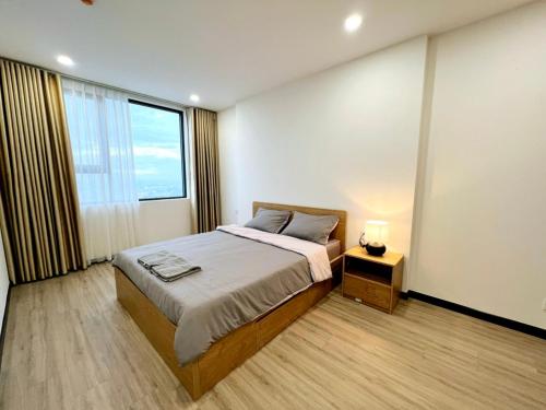 En eller flere senge i et værelse på C Sky View: 2 BR Apartment Free GYM & POOL